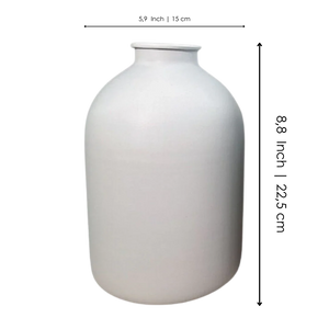 Large matte white ceramic vase with rounded body and narrow neck on plain background