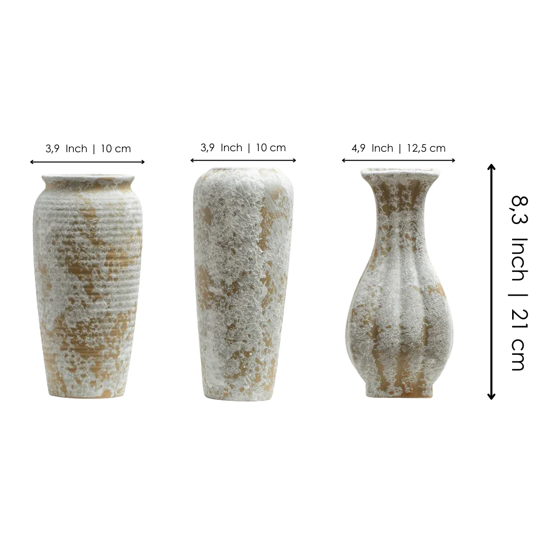 Set of three textured ceramic vases with white and beige rustic finish on black background