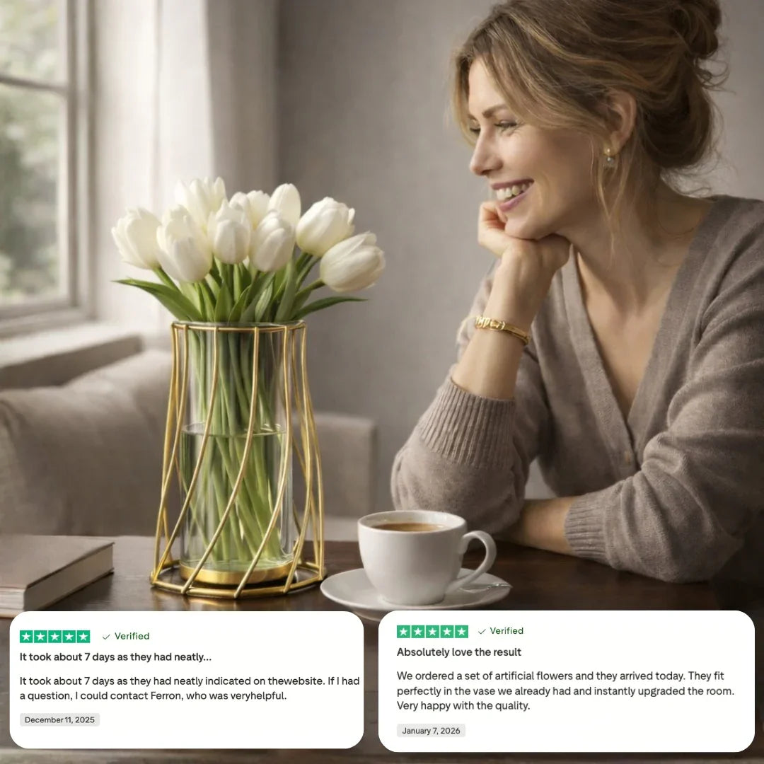 Smiling woman at table with white tulips in modern gold vase, coffee cup, and customer reviews.