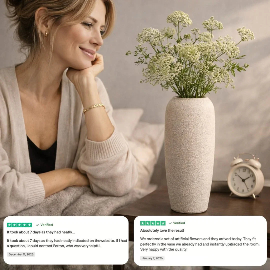 Woman admiring artificial flowers in textured beige vase on bedside table with reviews and clock